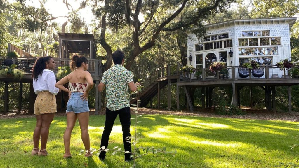 The World's Most Amazing Vacation Rental hosts standing outside Bolt Farm Treehouse in Charleston, SC - Courtesy Netflix
