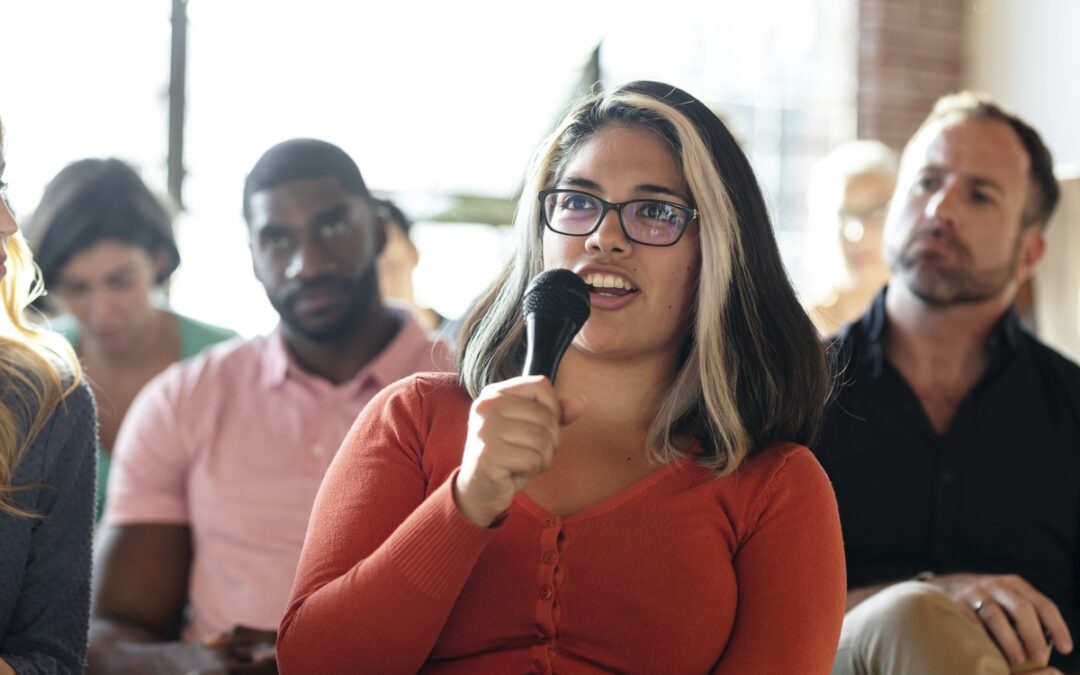 woman speaking during a public hearing