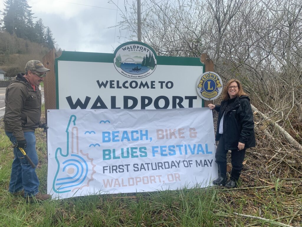 Jamie Michel, right, volunteers at the Beach, Bike & Blues Festival in Waldport, Oregon.