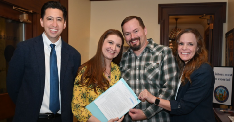 Ricco Garcia of Airbnb Government Relations, Melissa and Jeremy Radford, and IVRA Vice President Cara Hipwell